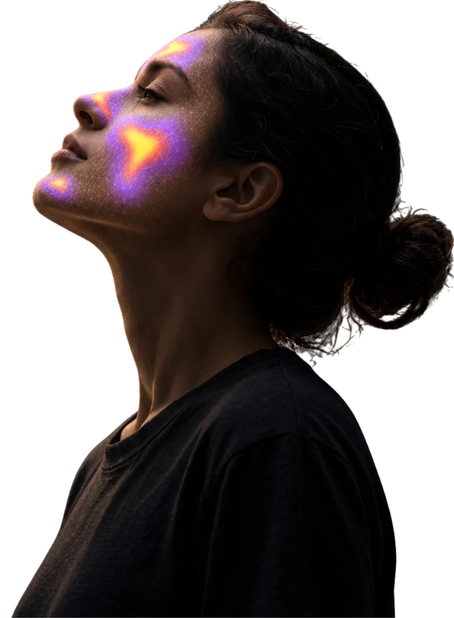 A person in profile looking upward, a scan mesh reading across their cheek and brow.